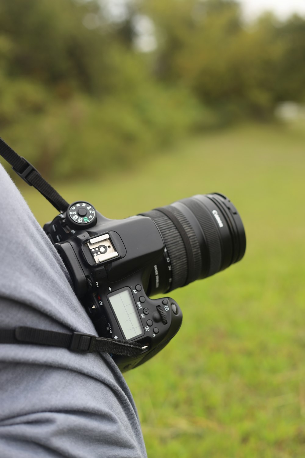 a person holding a camera in their hand