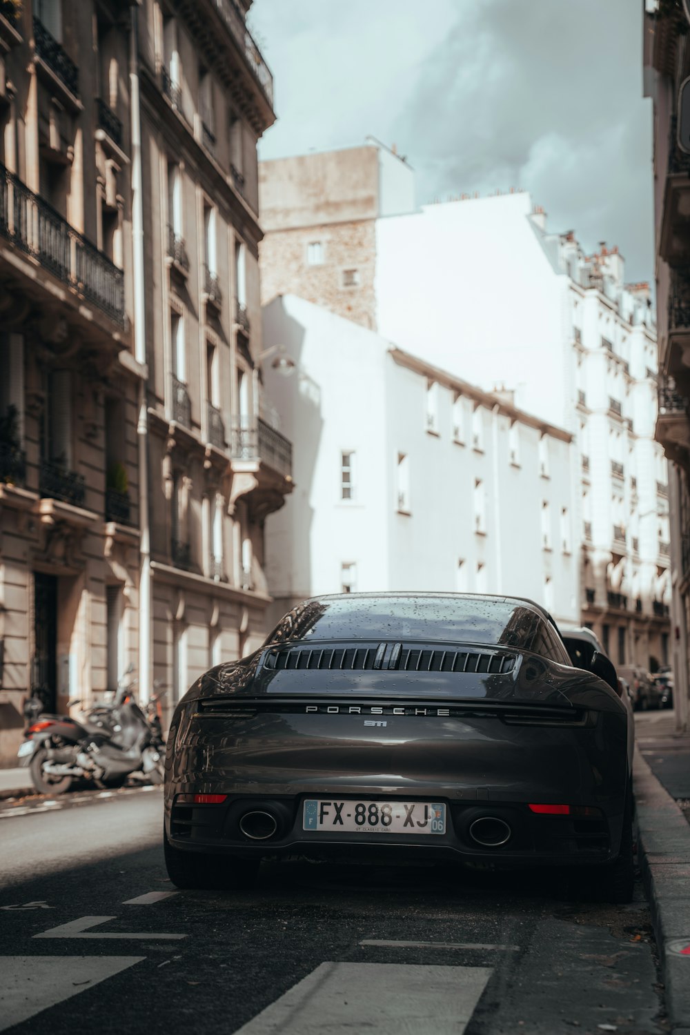 a black sports car parked on the side of the road