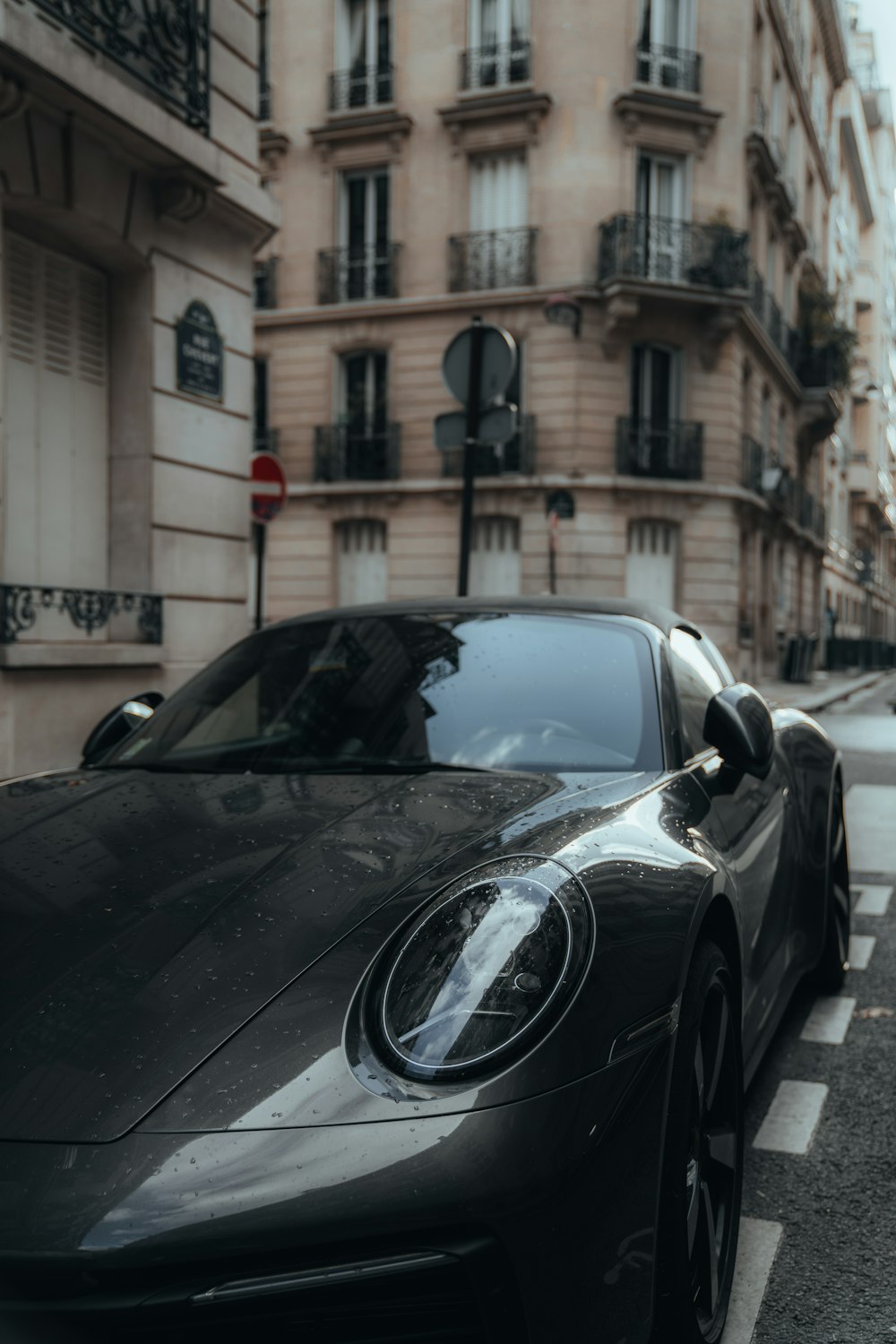 a black sports car parked on the side of the road