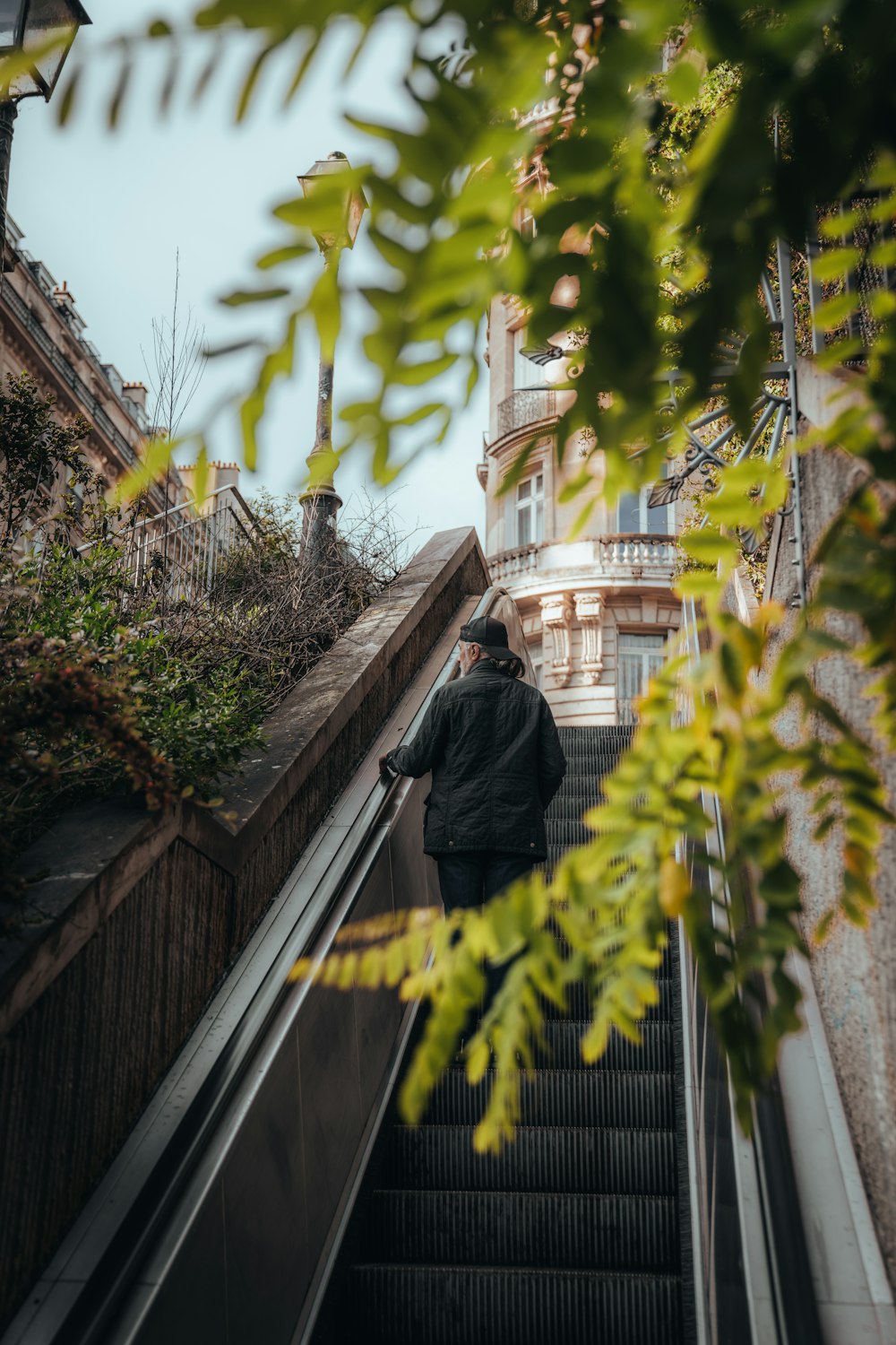 a man riding an escalator down a set of stairs