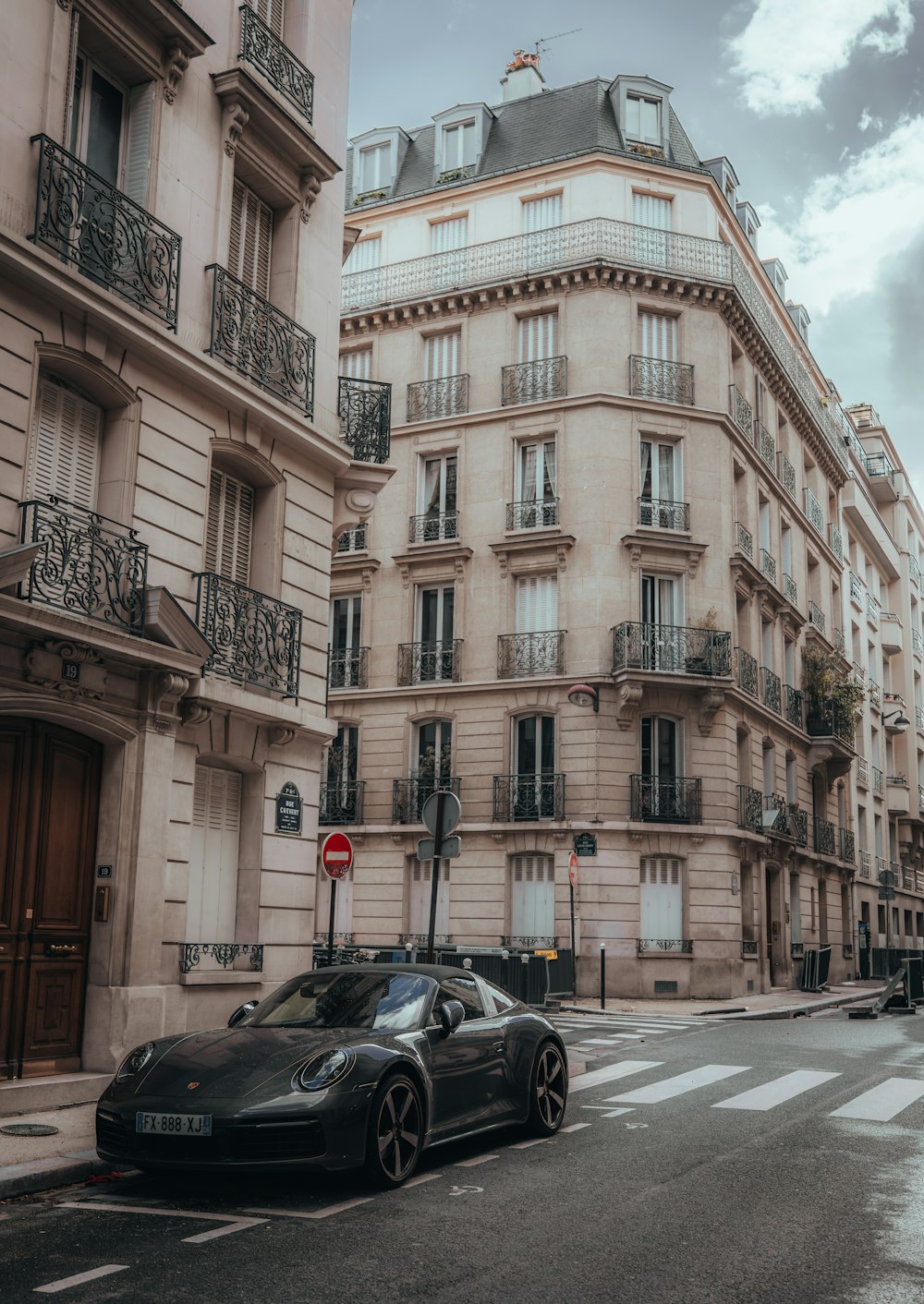 a black sports car parked on the side of a street
