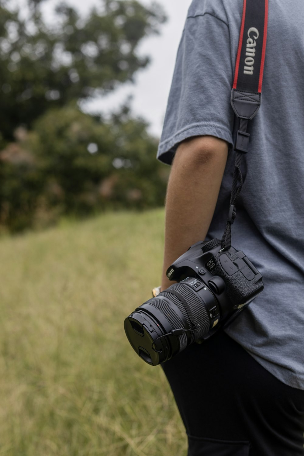 a man holding a camera in his right hand