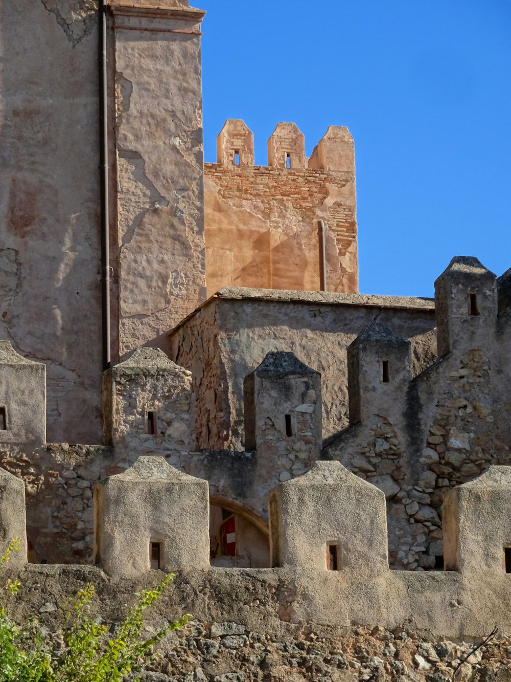 a stone building with a clock tower on top of it