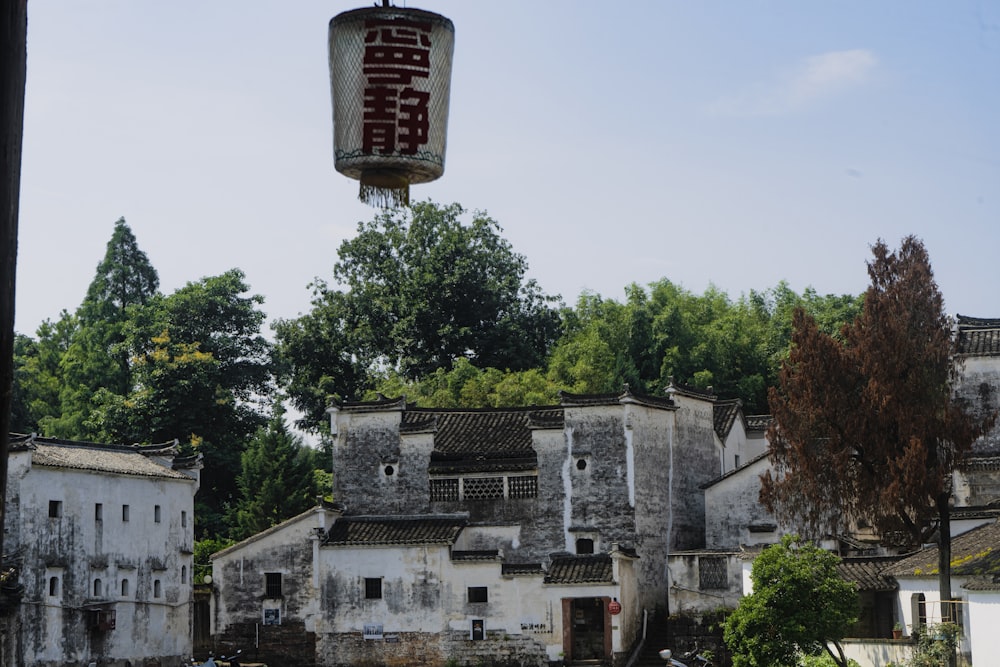 a building with a chinese sign hanging from it's side