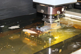 a close up of a machine cutting a piece of metal