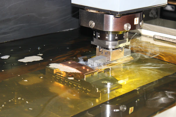 a close up of a machine cutting a piece of metal