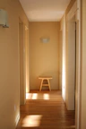 Warm and inviting hallway with natural wood finishes and alpine-inspired decor.