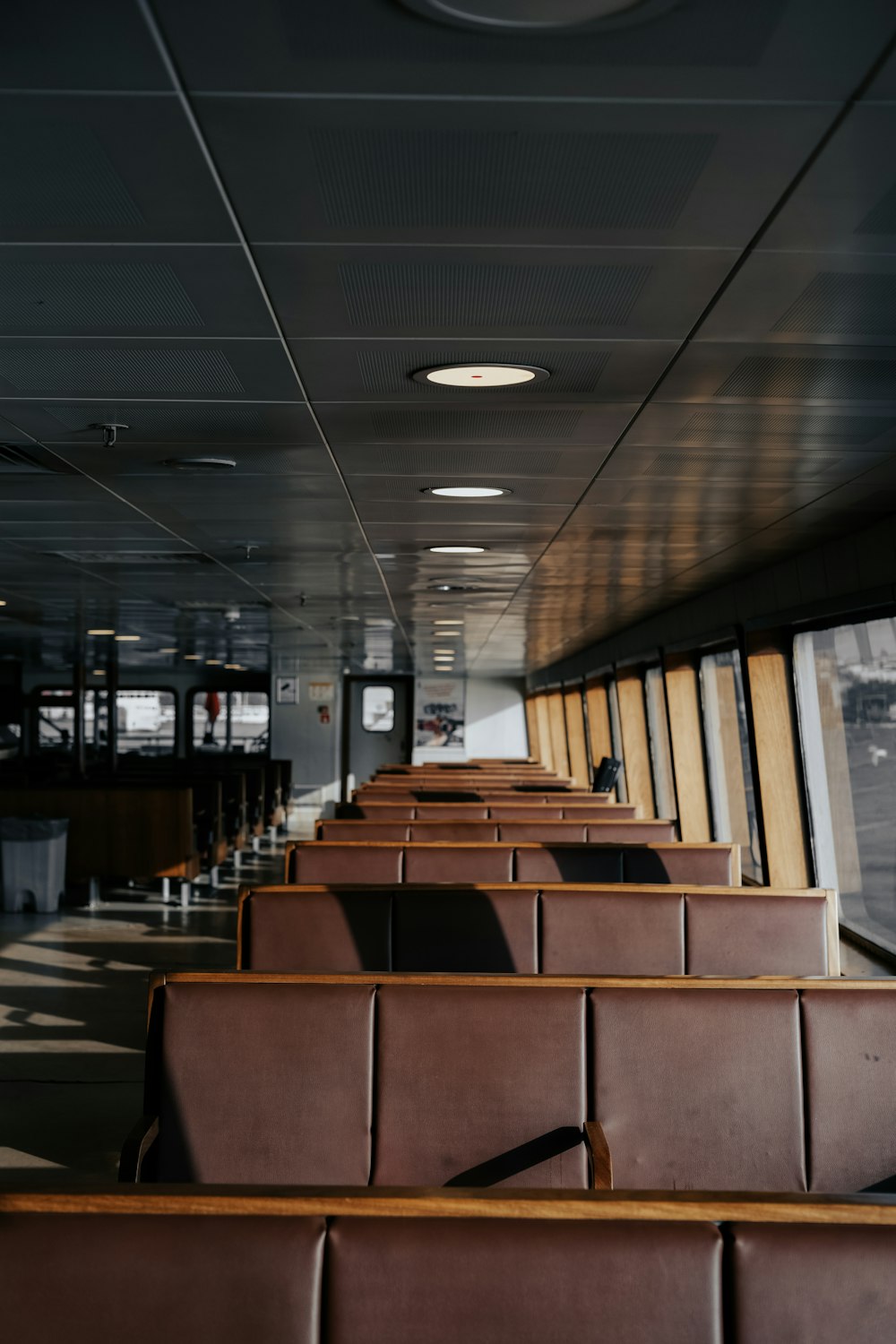 a row of seats sitting next to each other on a train