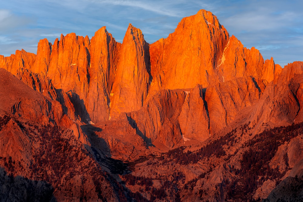 a very tall mountain with a sky background