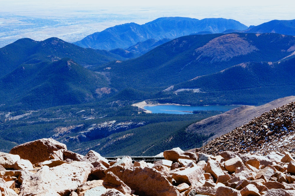 a view of a mountain range with a lake in the distance