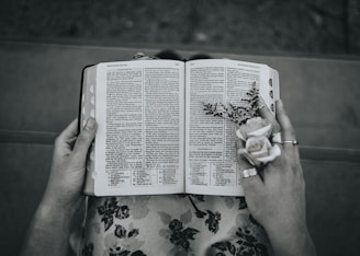 A close-up of weathered hands gently holding a worn Bible, symbolizing faith and renewal.