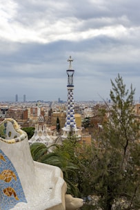 A panoramic view of Park Güell showcasing colorful mosaics and city skyline.