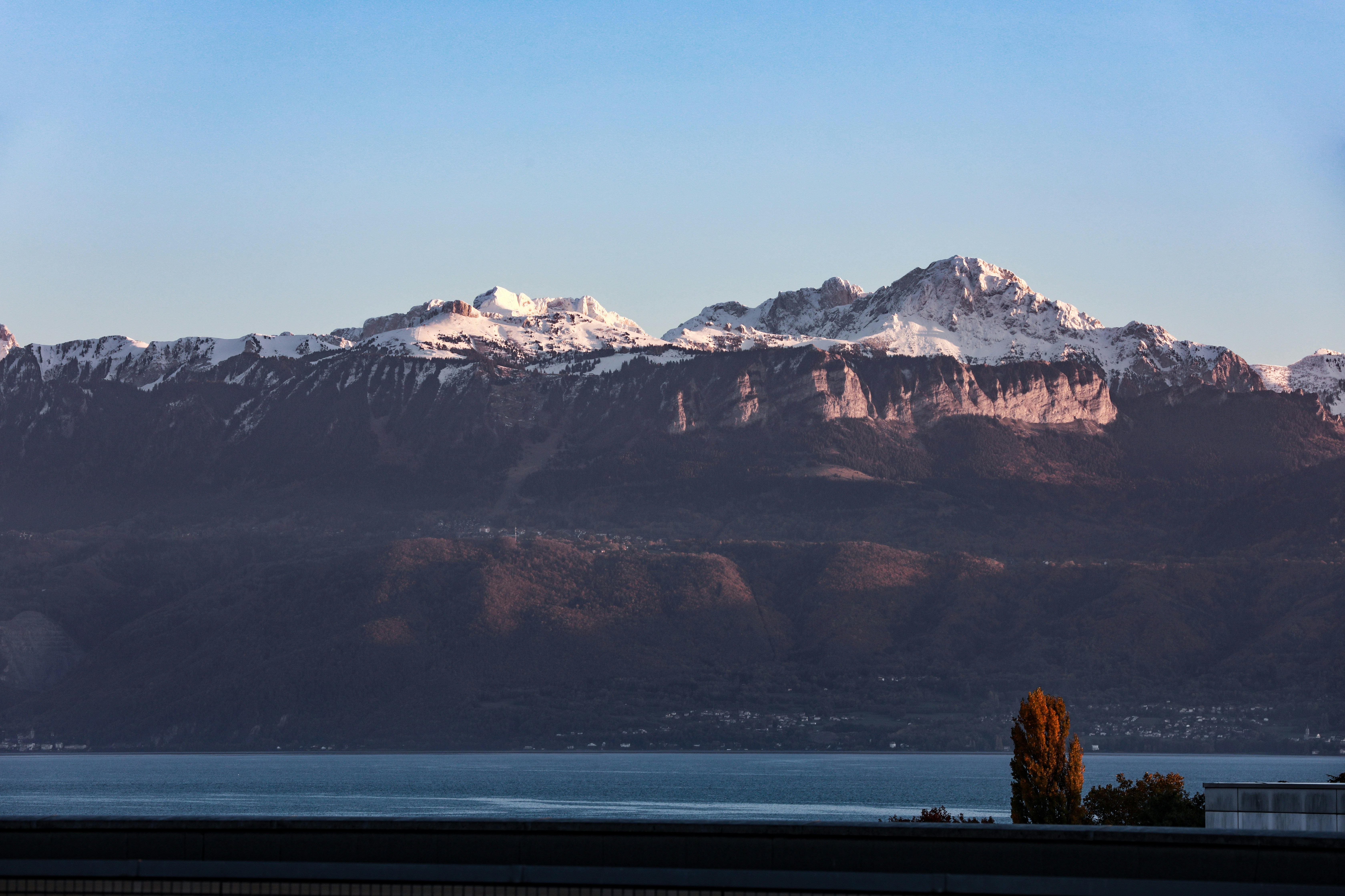 A view of a mountain range with a lake in Switzerland