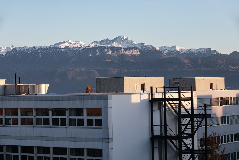 a view of a building with mountains in the background