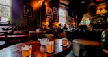 A cozy southern lounge setting with warm lighting and comfortable seating for intimate conversations.
