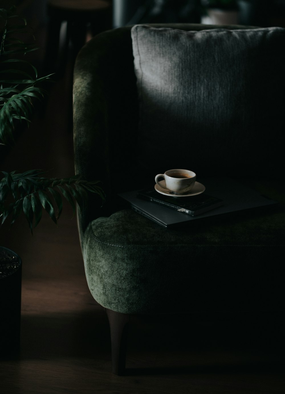 a book and a cup on a chair