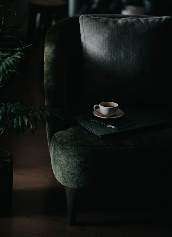 Coffee set down on a dark polished table