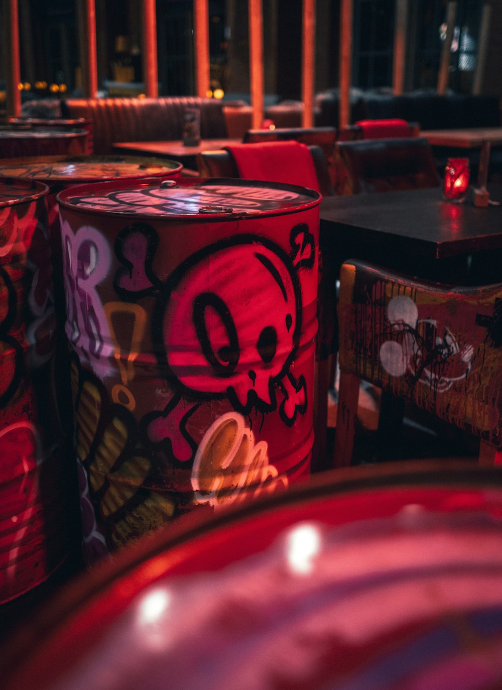 a room filled with lots of tables covered in graffiti