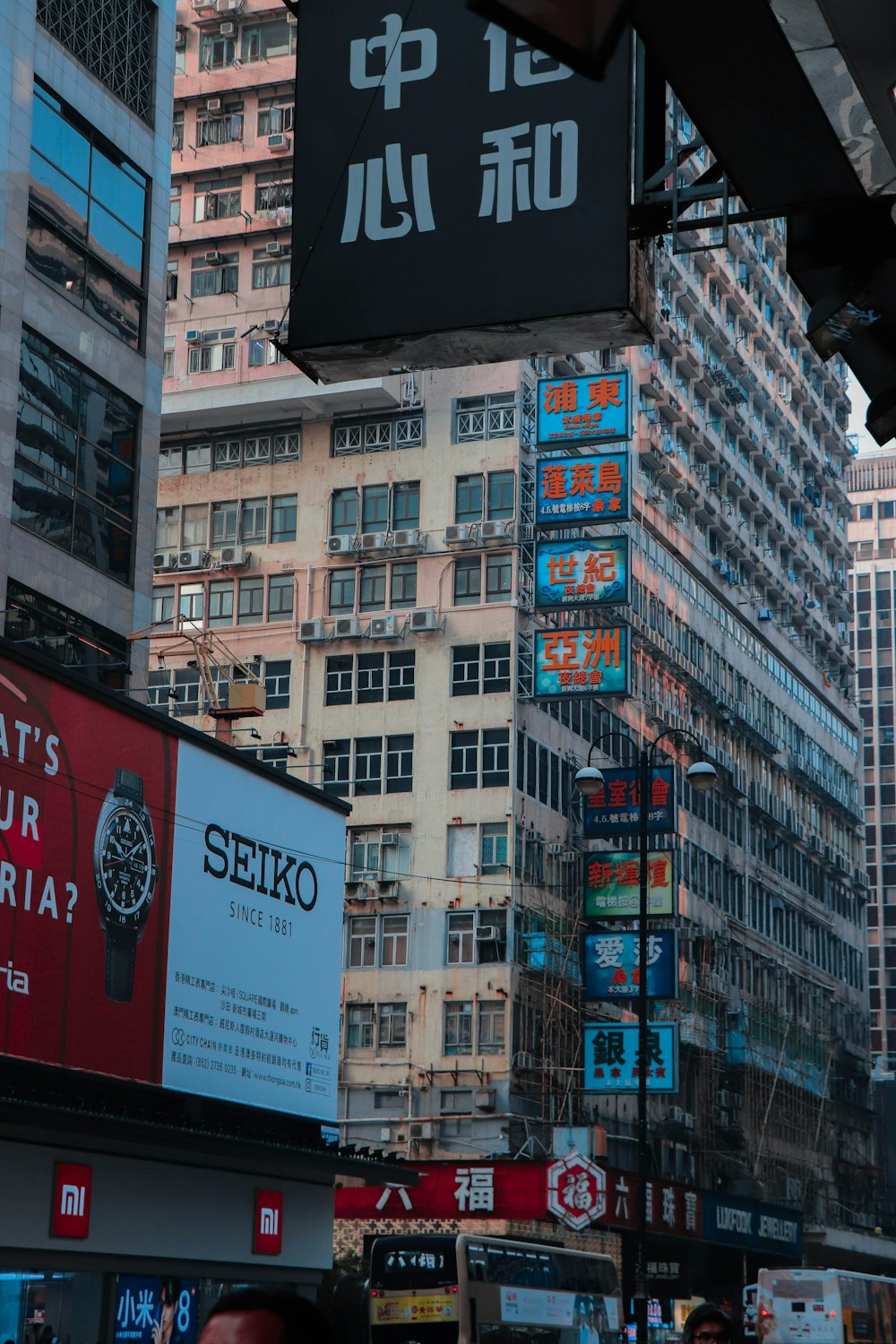 a city street filled with lots of tall buildings