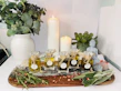 A serene therapist preparing oils in a cozy home setting.