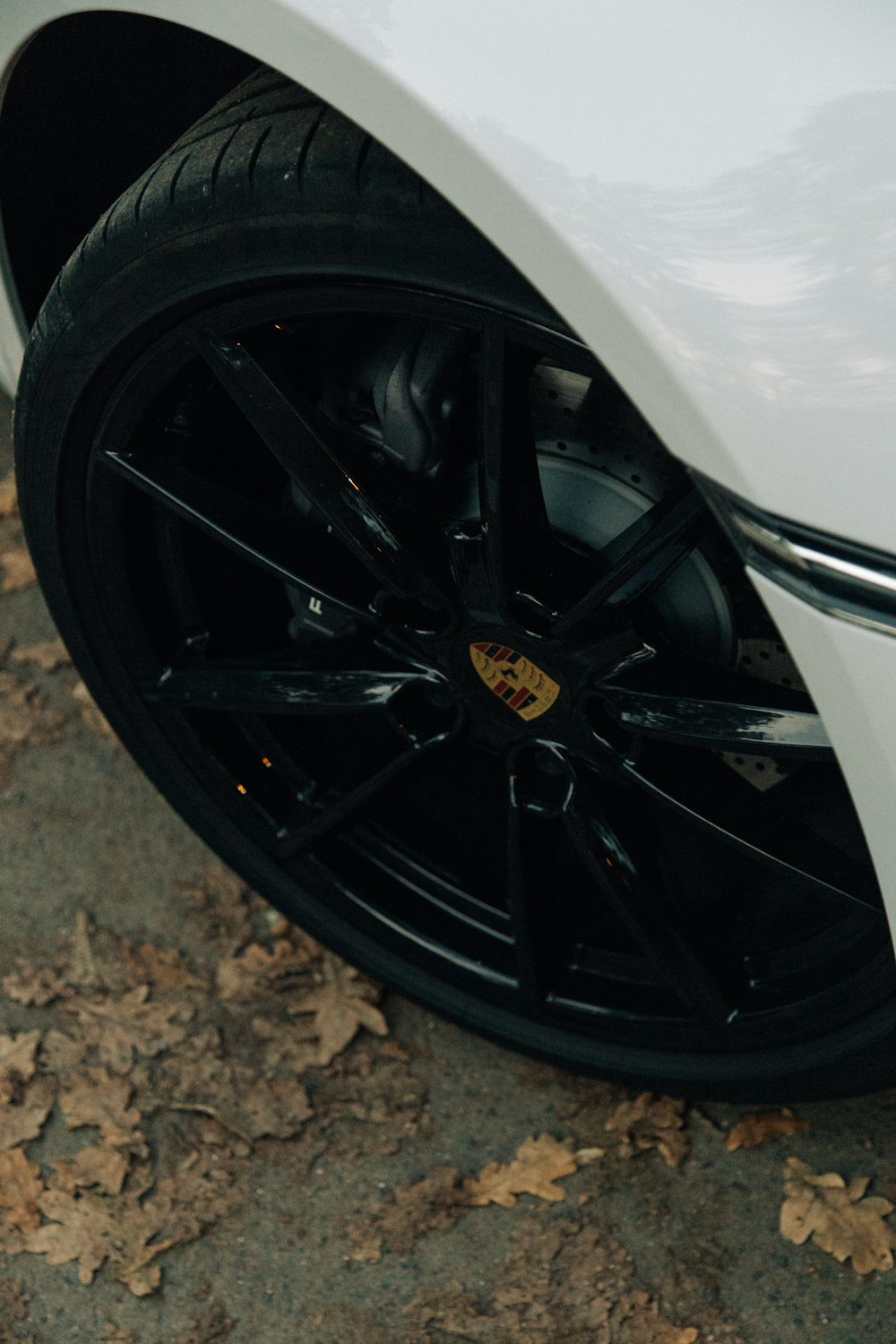 a close up of a white sports car tire