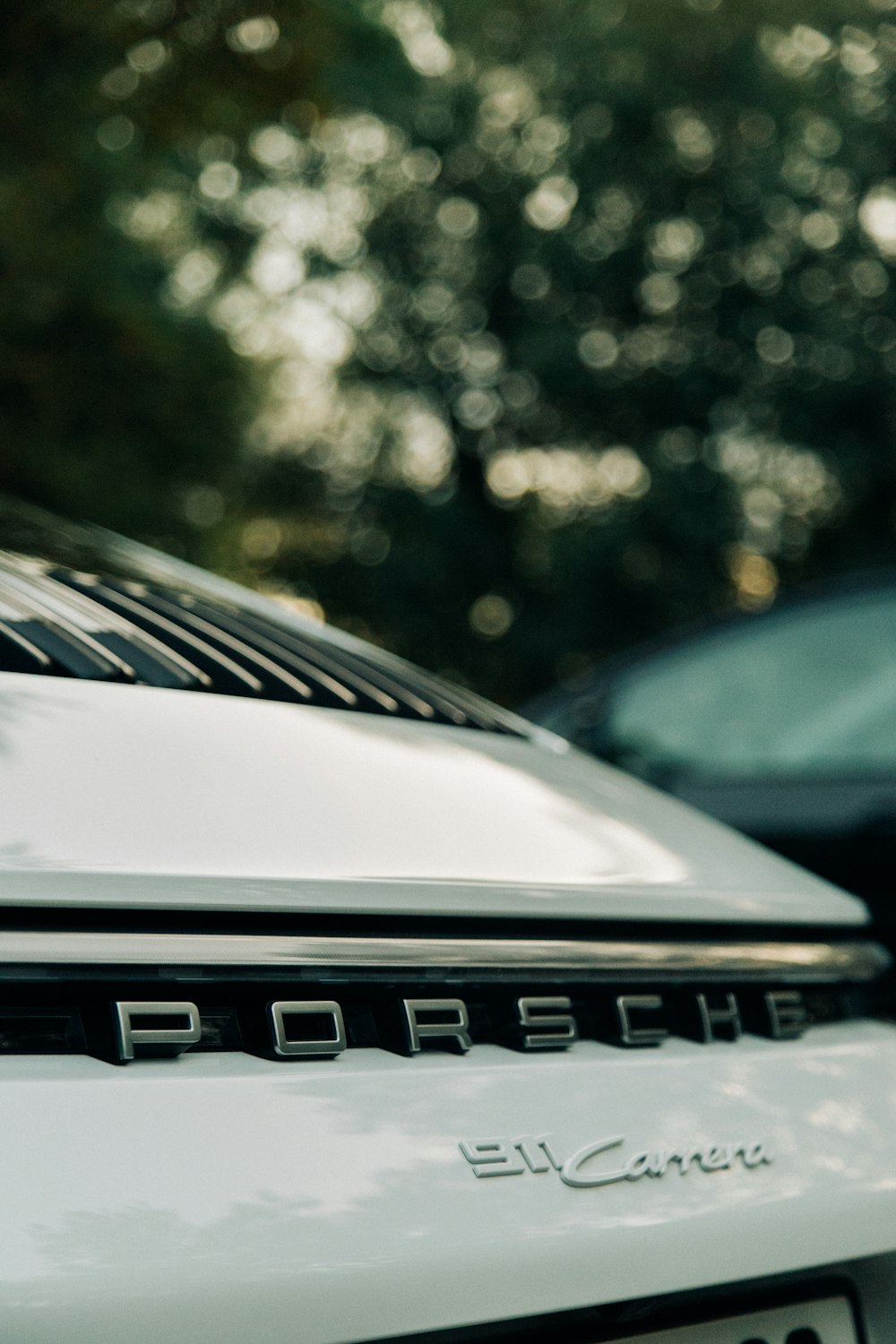 a close up of a porsche logo on a car