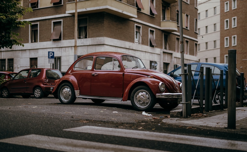 a red car parked on the side of the road