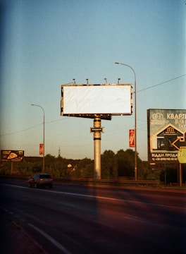 a billboard on the side of the road
