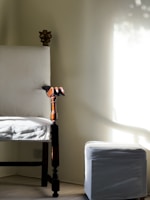 A cozy vintage wooden chair with a worn leather seat in a softly lit room.