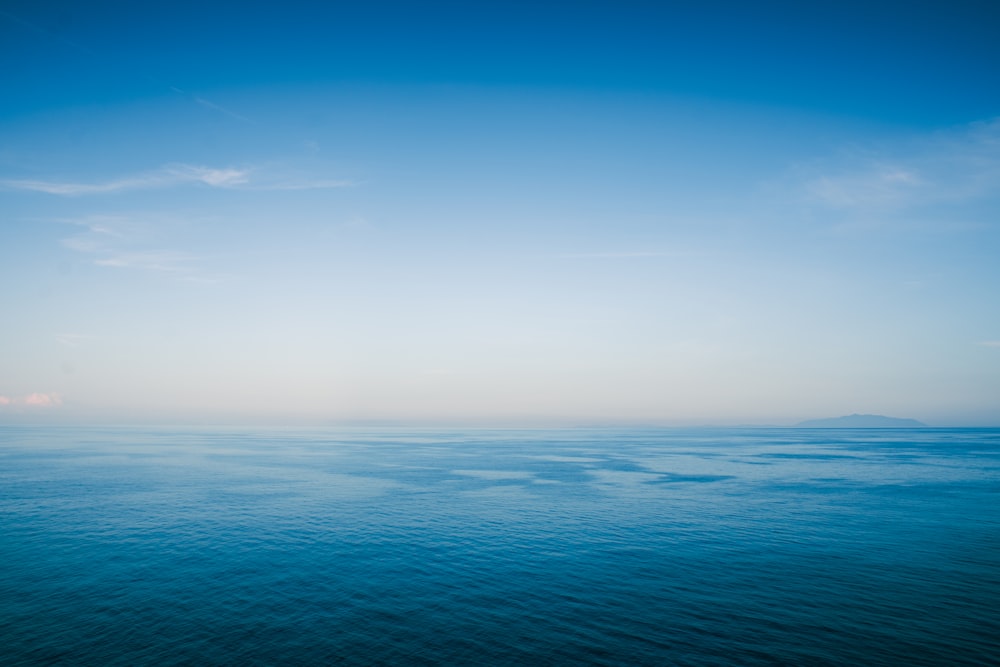 a large body of water with a sky background