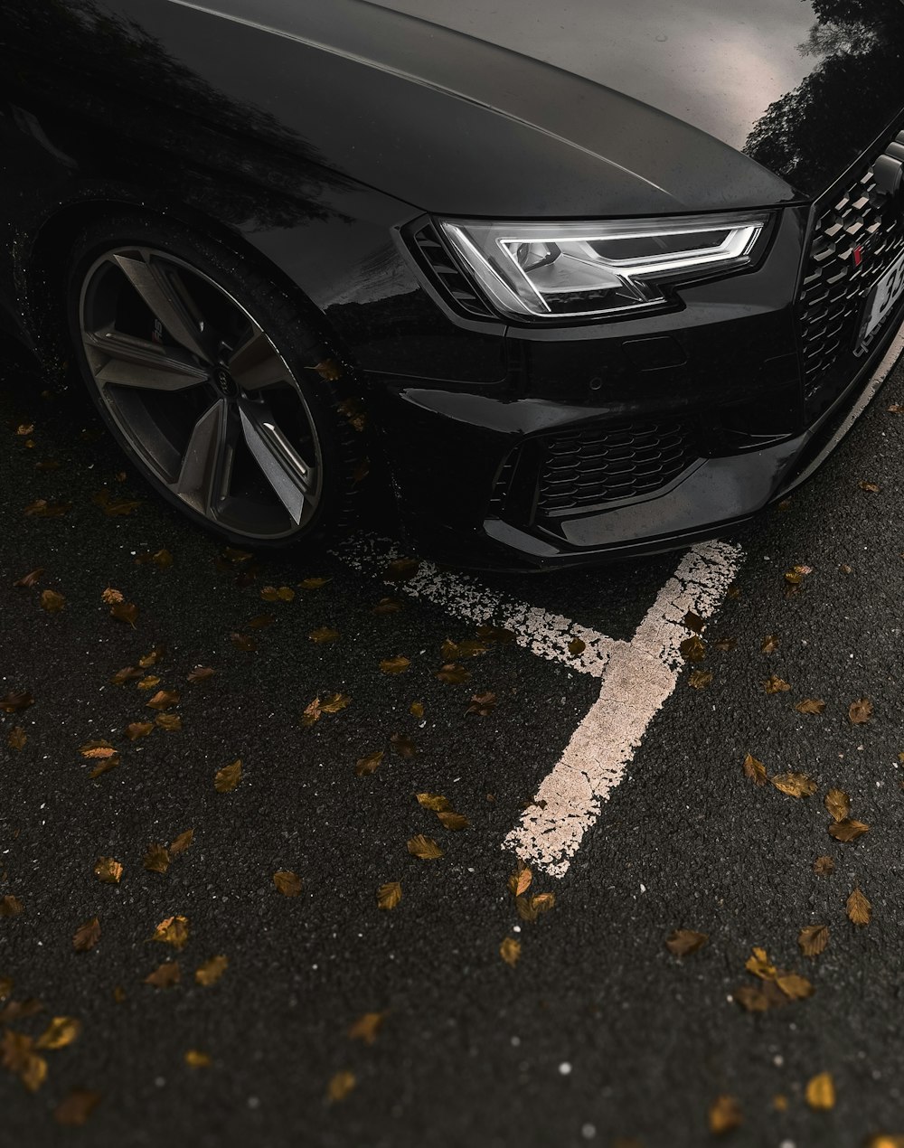 a black car parked on the side of the road