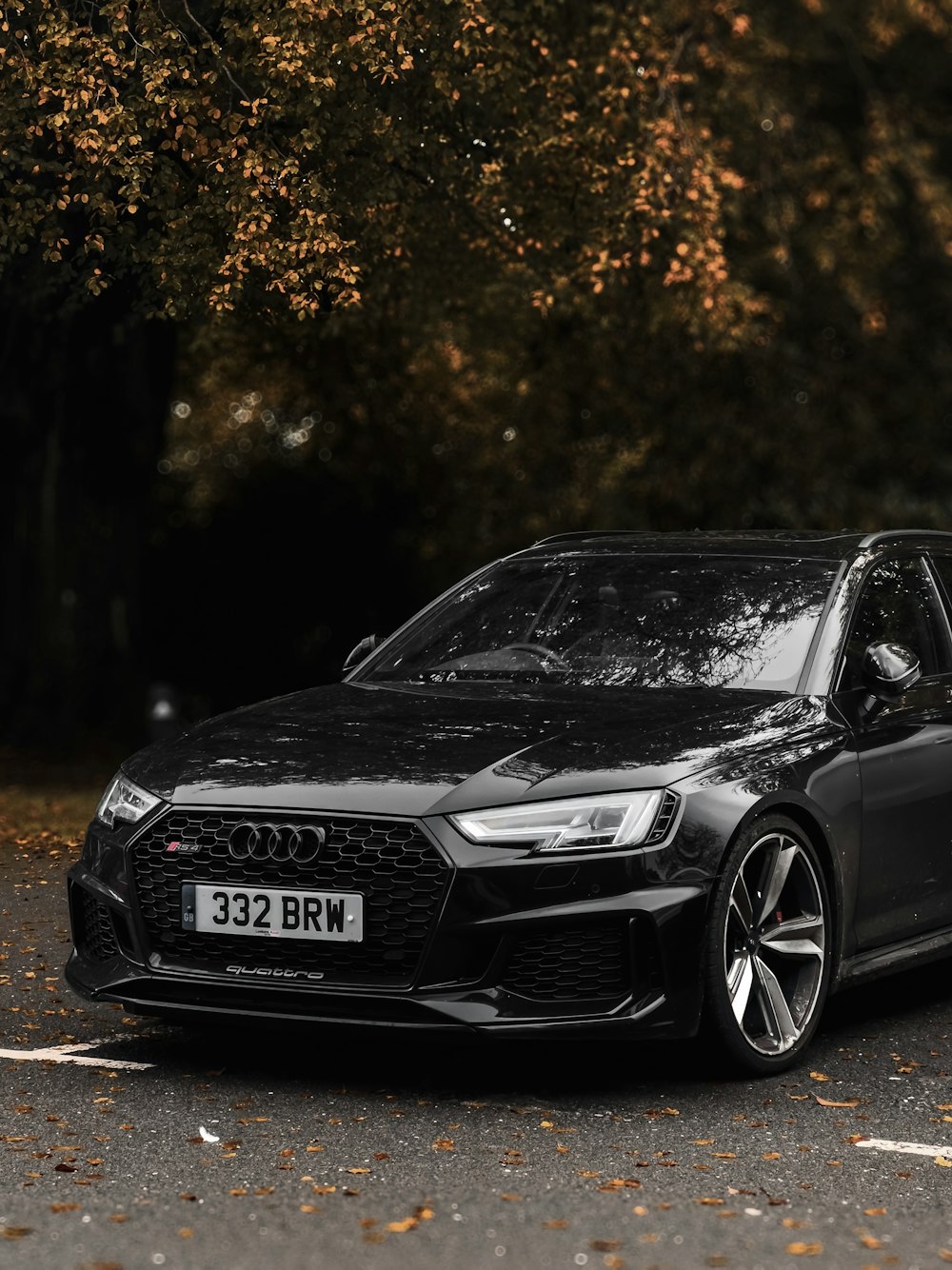 a black car parked on the side of the road