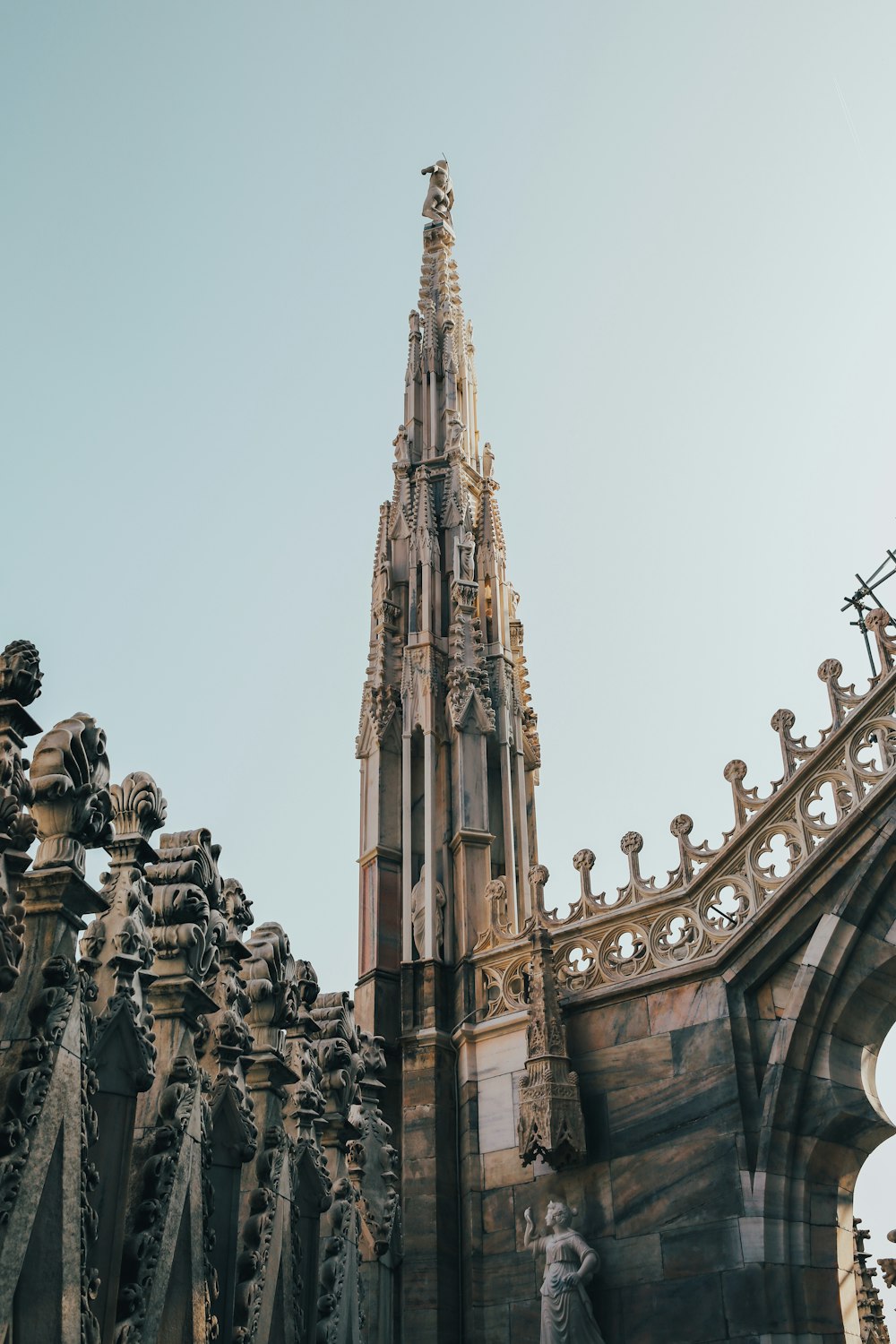 a very tall building with a clock on it's side