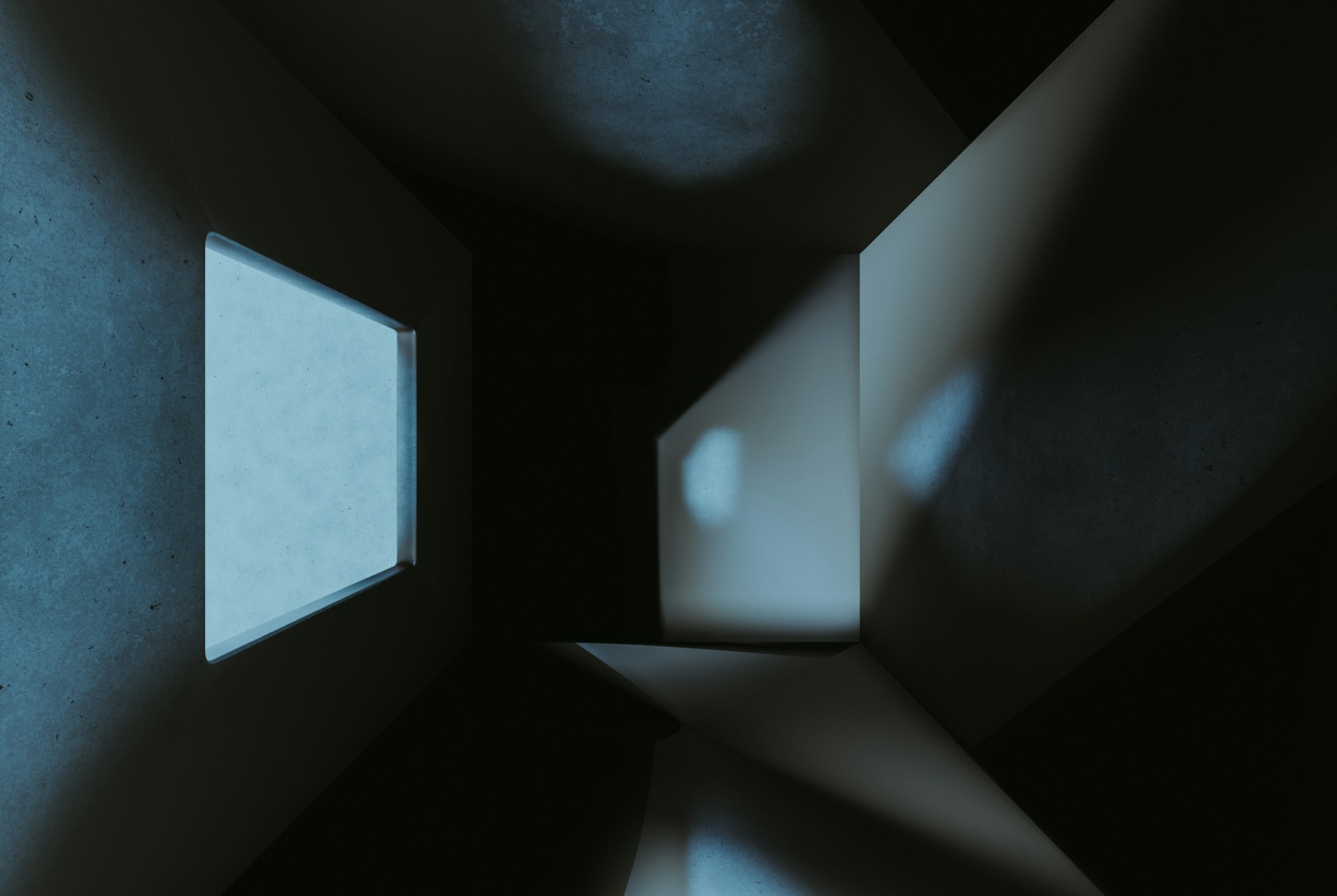 a dark room with a small window in it