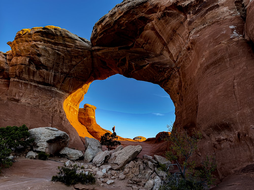 a person standing in the middle of a rock formation