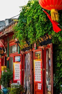 A vibrant storefront of muanhanh bustling with customers and colorful promotional banners.