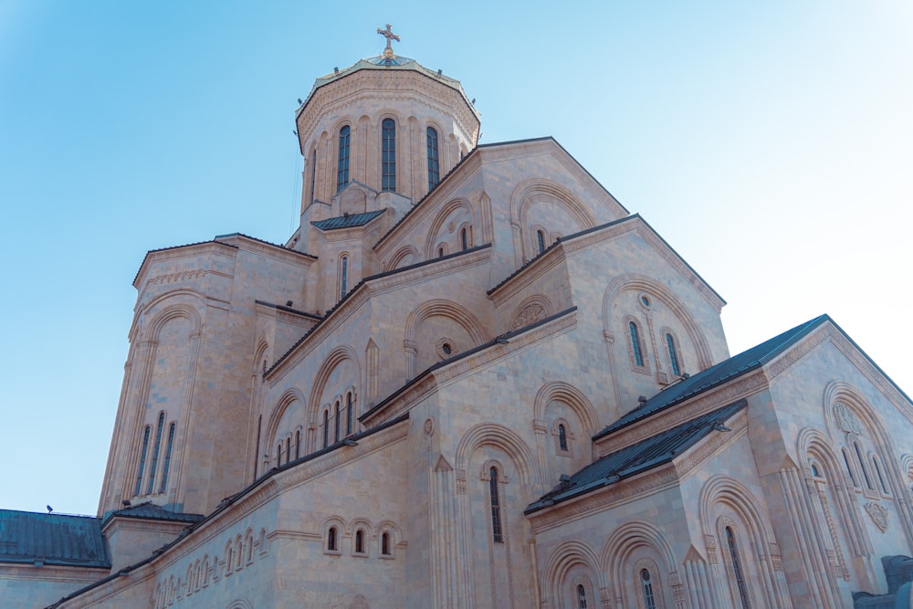 a large cathedral with a cross on top of it