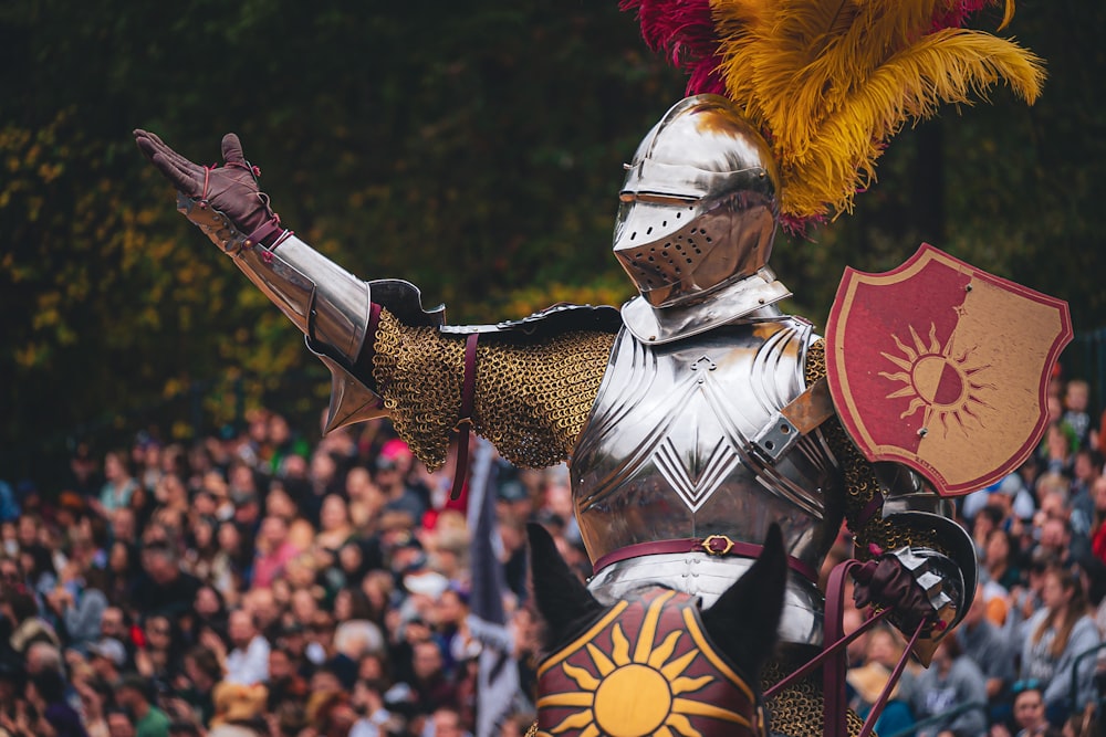 a man dressed in armor and holding a shield