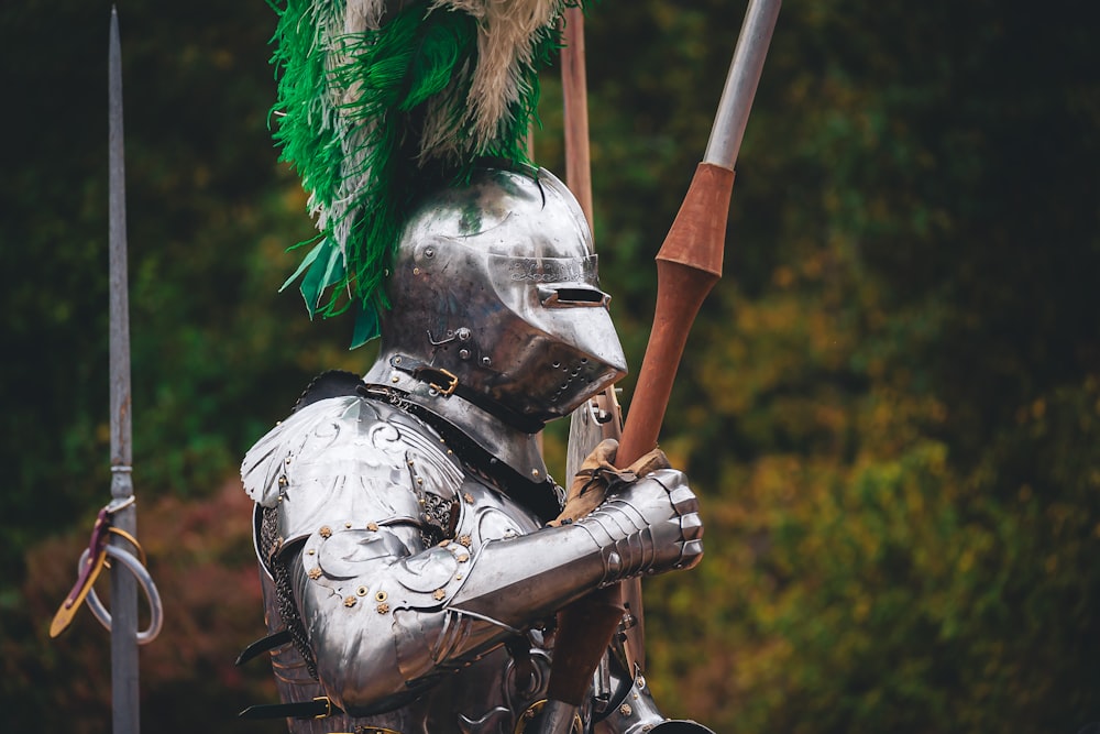 a man in a suit of armor holding a sword