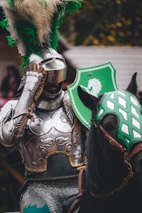 a man in a green and white costume on a horse