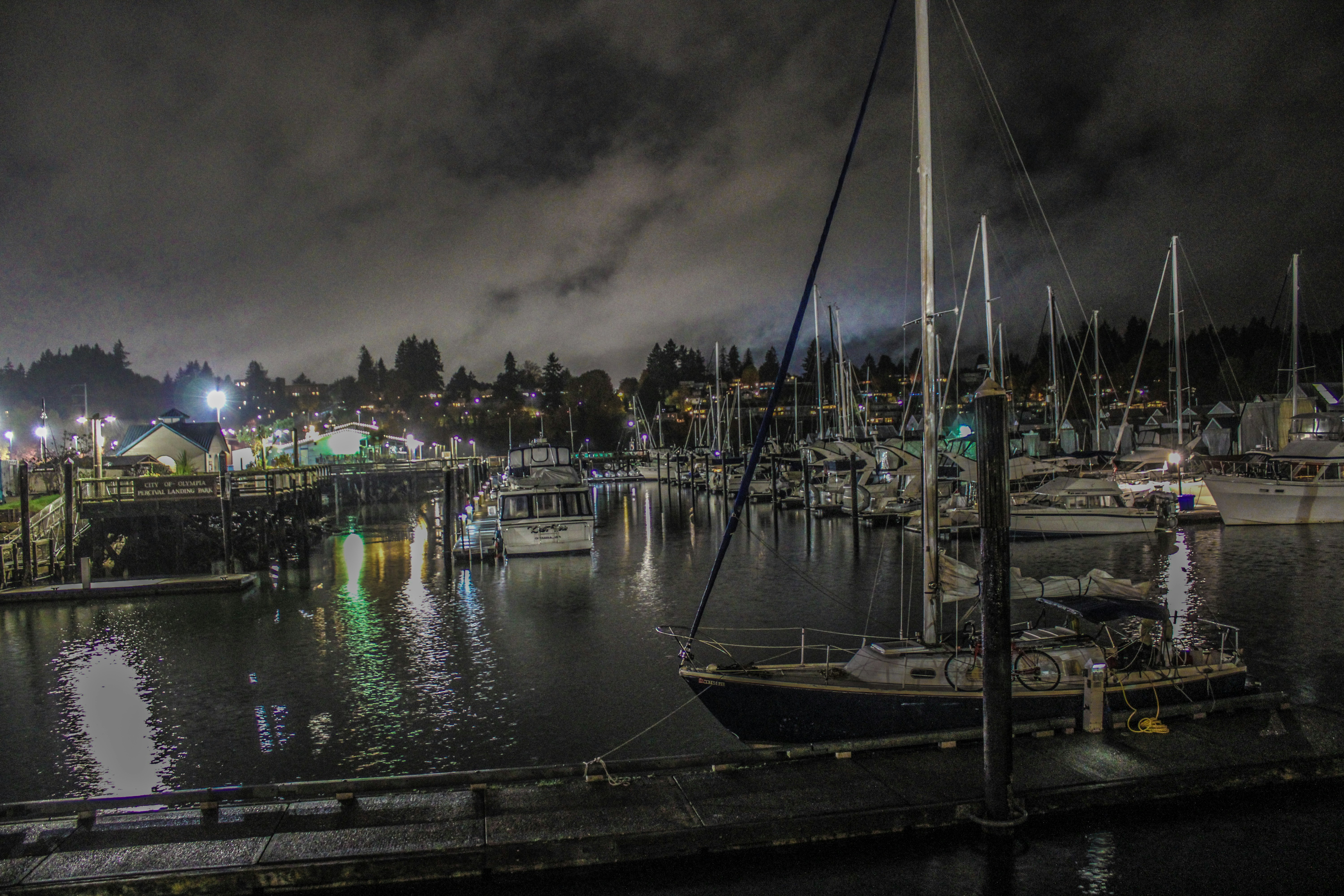 a harbor filled with lots of boats at night