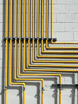 Plastic piping and fittings neatly installed in a construction site.