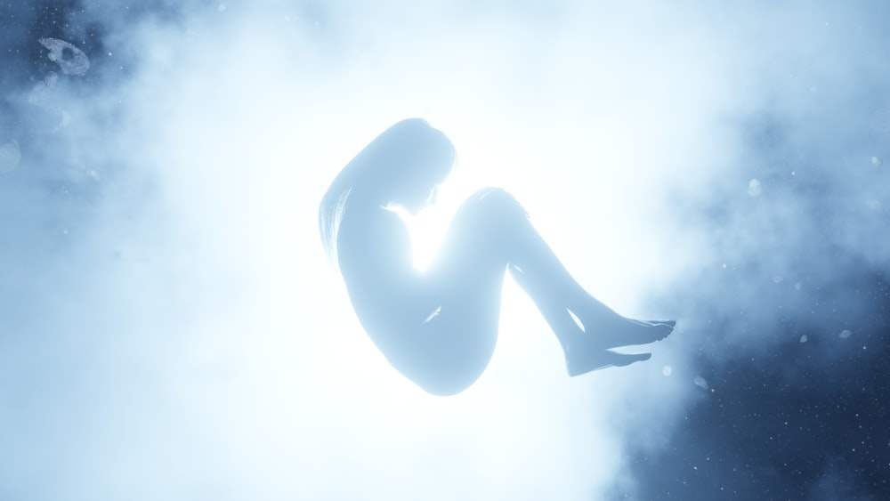 a woman sitting on a cloud in the sky