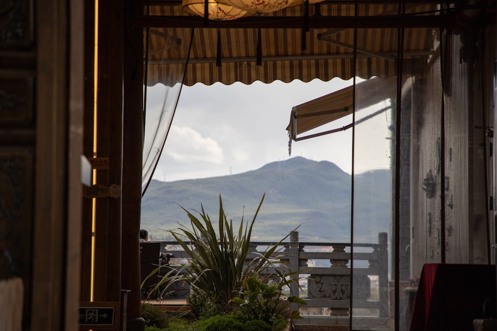 a balcony with a view of a mountain