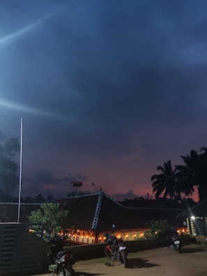 Evening view of Villa Melati Mas illuminated with warm outdoor lights