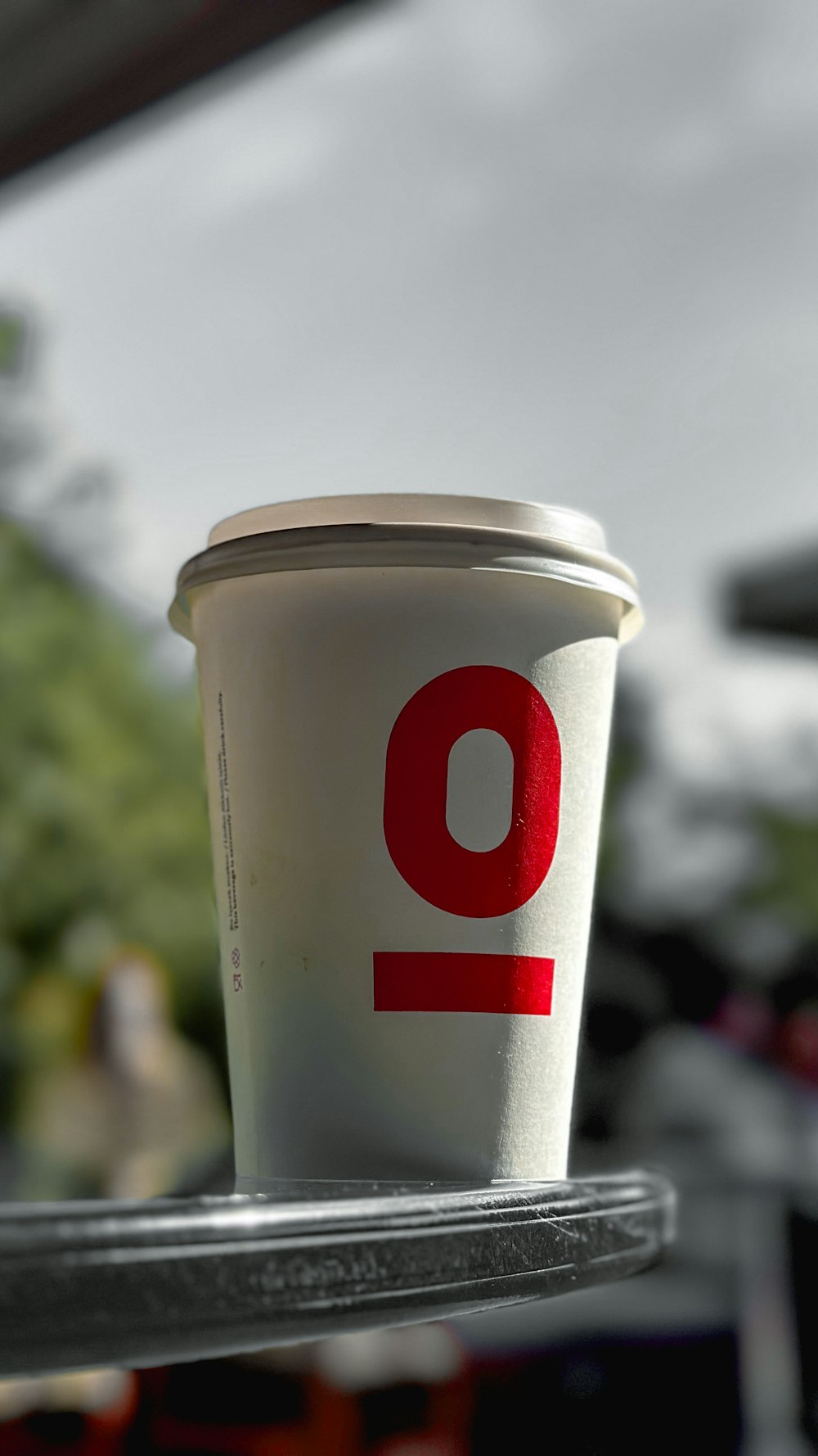 a cup of coffee sitting on top of a table