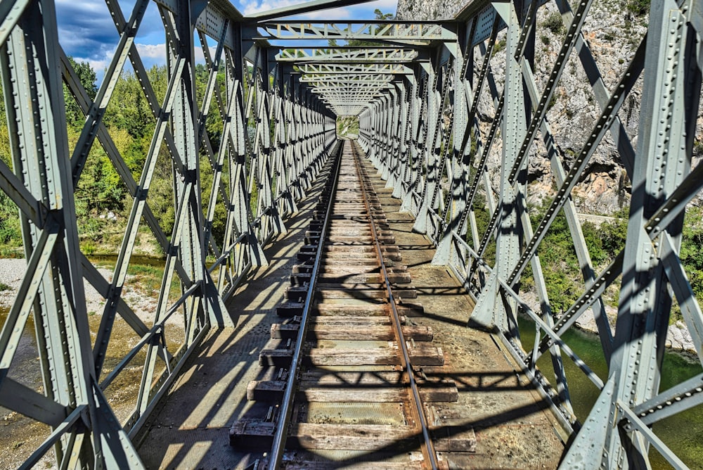 a train traveling across a bridge over a river