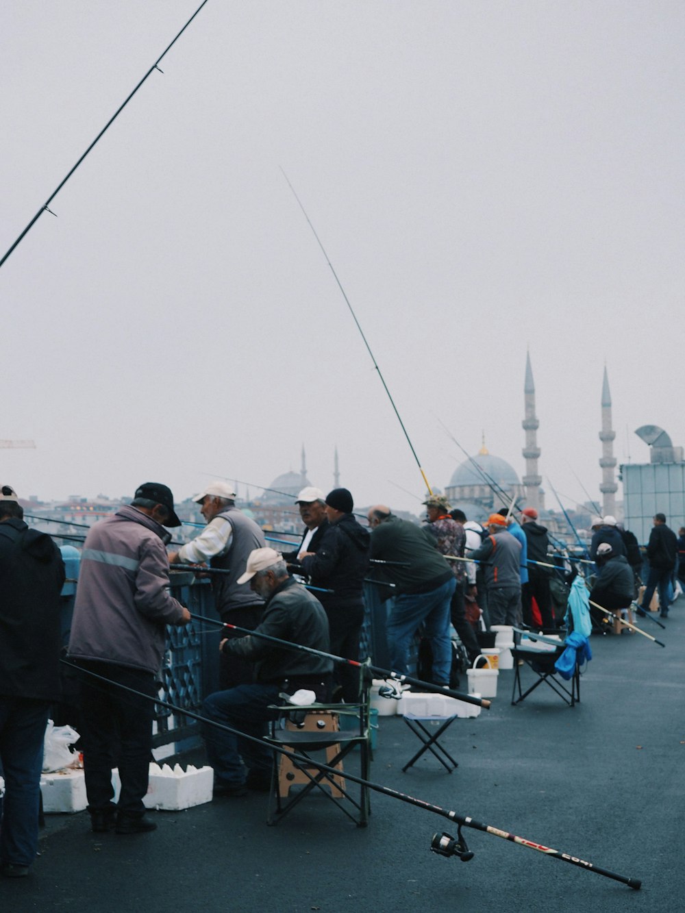 a group of people standing on top of a boat