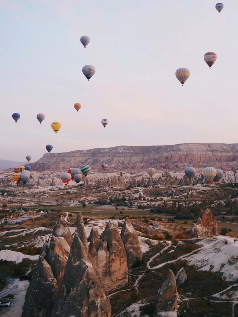 a bunch of hot air balloons flying in the sky