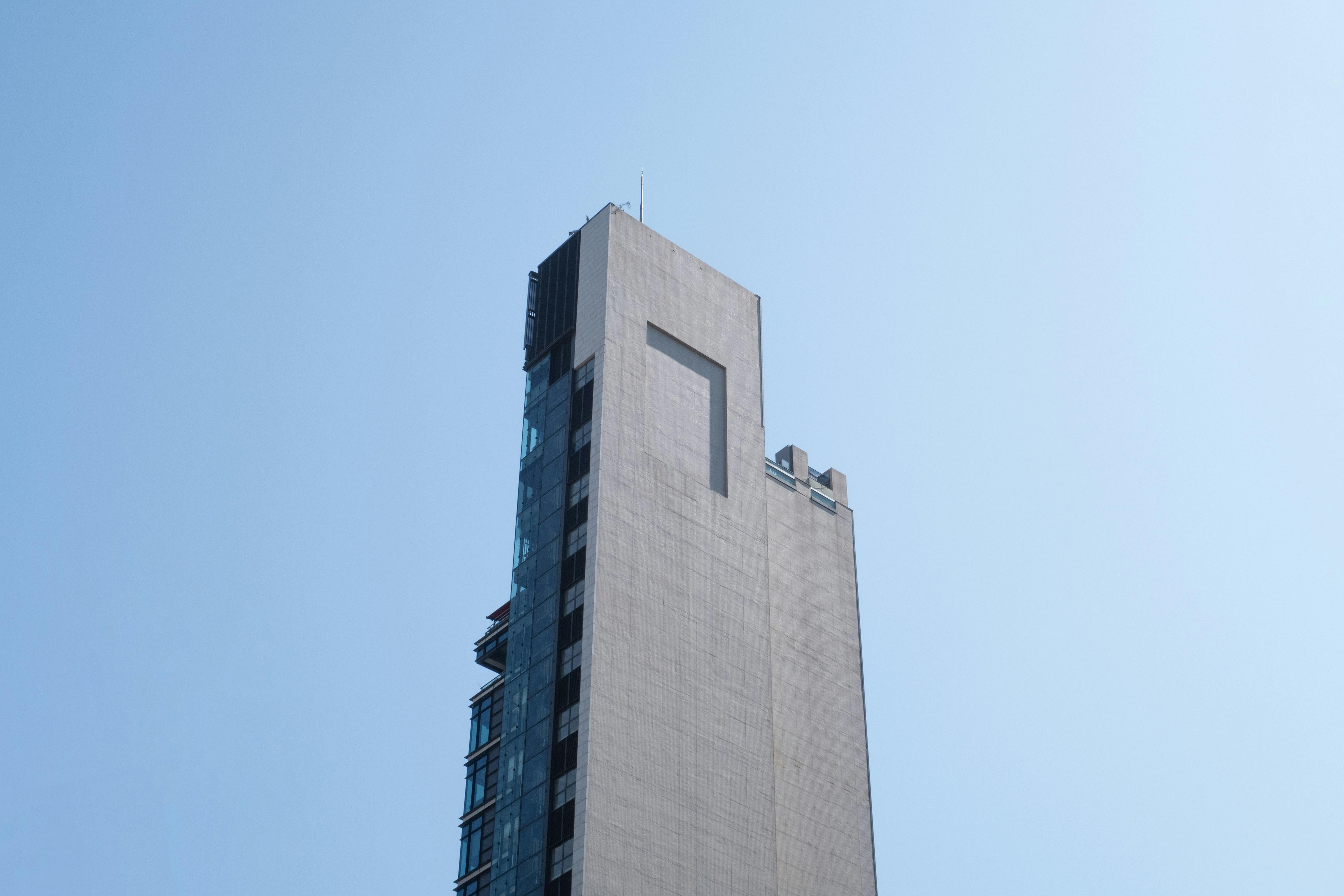 a tall building with a sky background